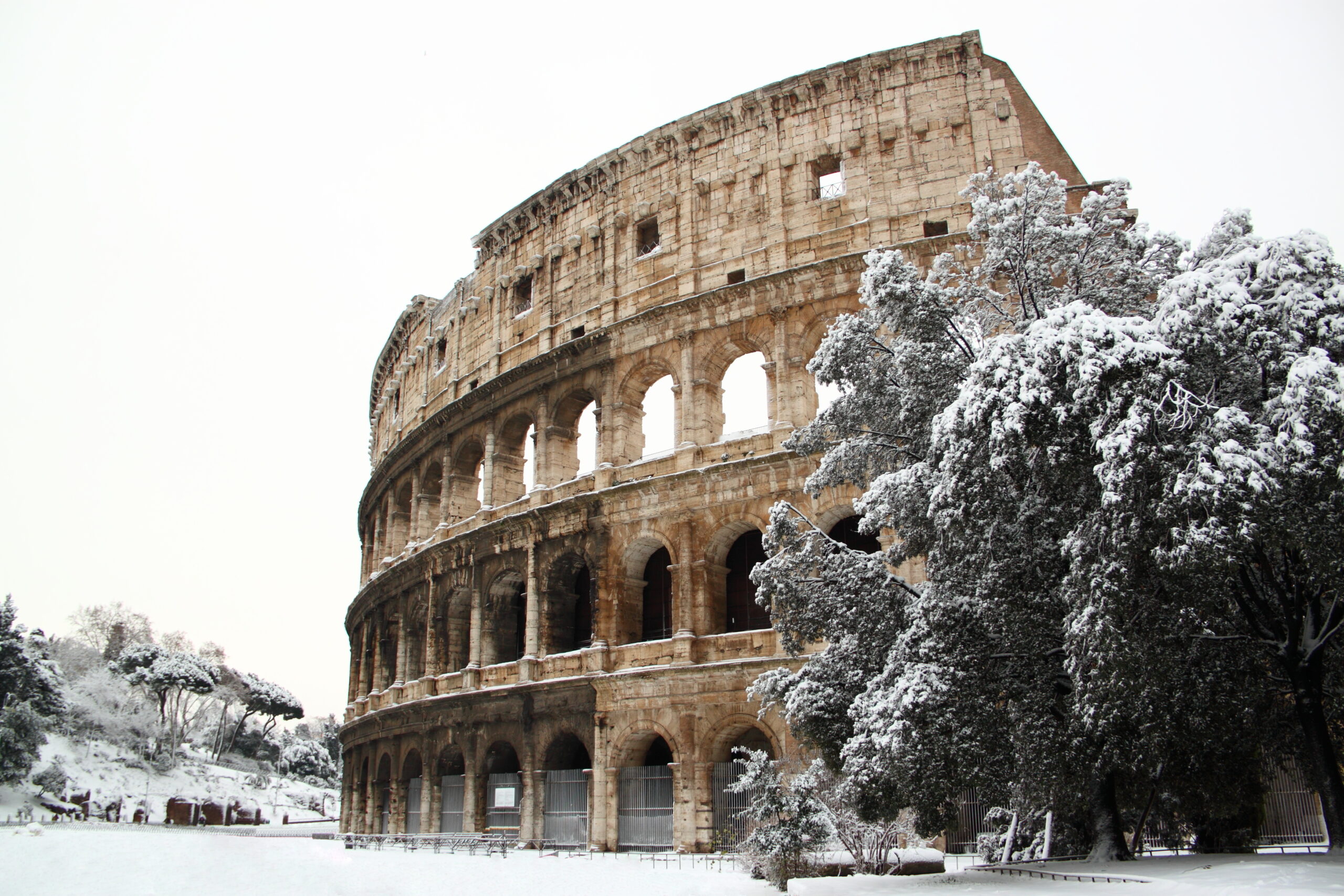 View of the famous colosseum in Rome in the snow  