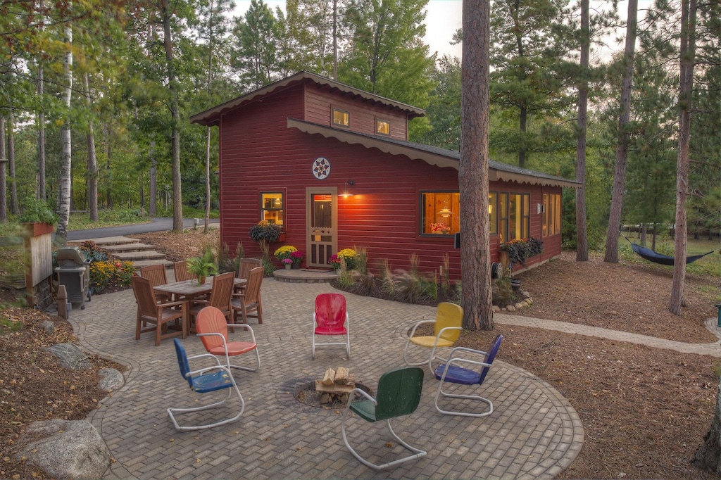 exterior view of the red sided classic minnesota cabin