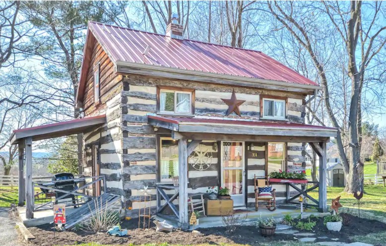 view of the outside of this amazing log cabin in Maryland