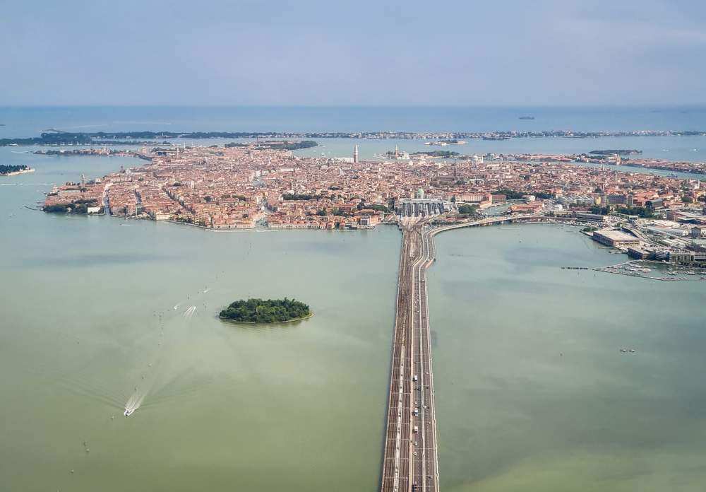 an arial view of the bridge connecting the mainland to venice island