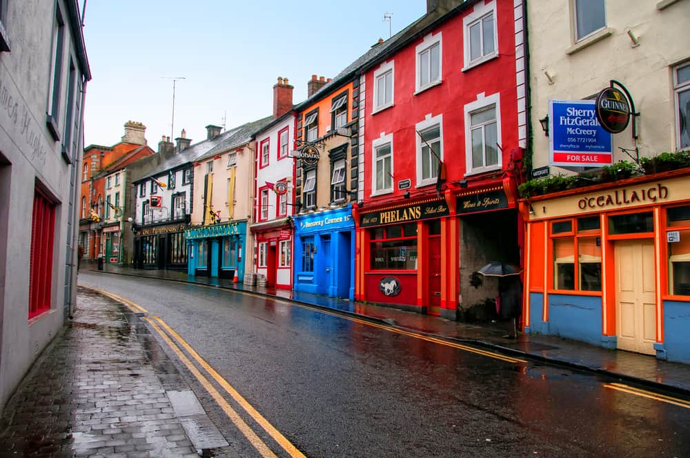 rows of irish pubs in the rain