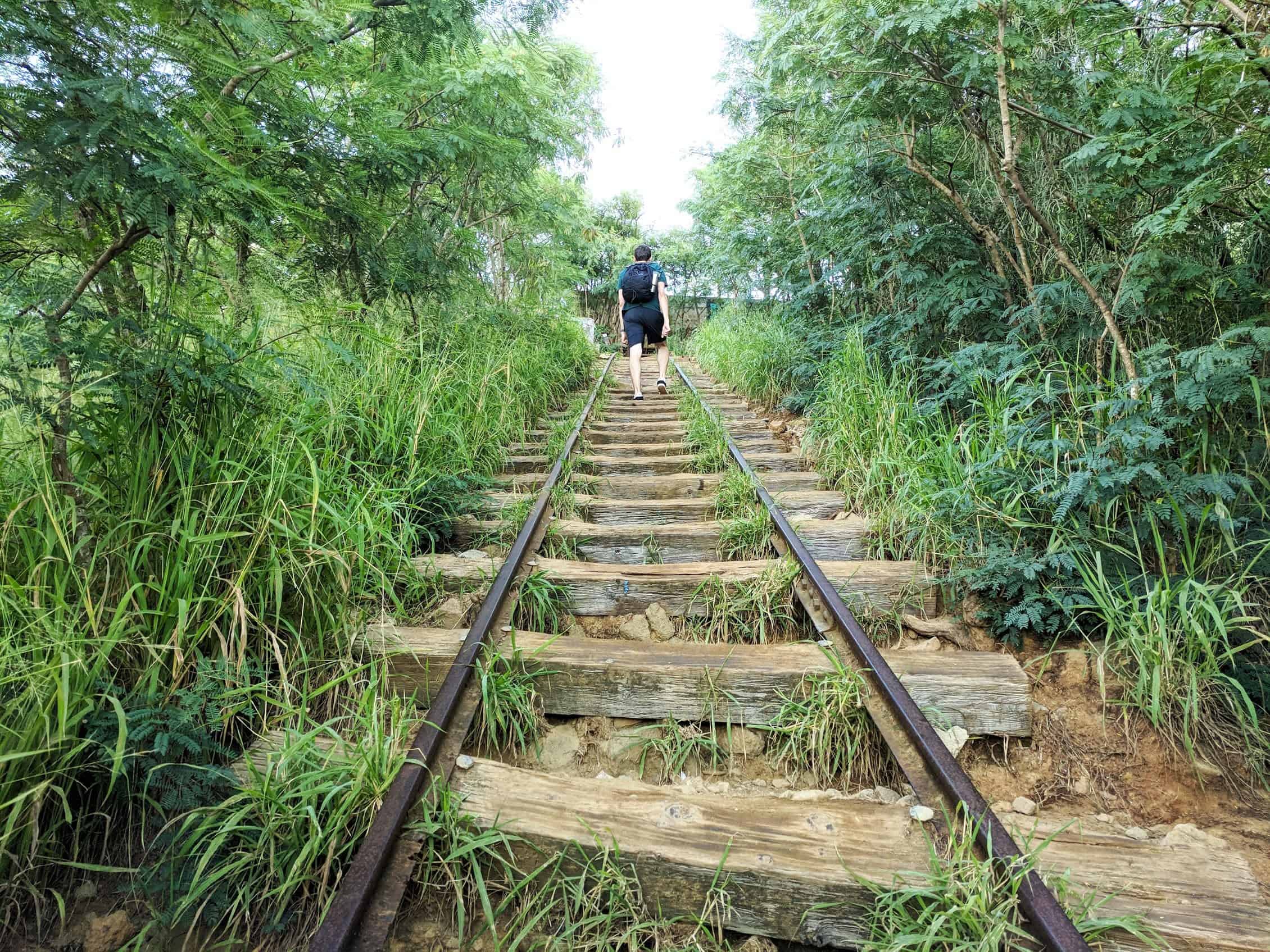 climbing stairs at koko head one of the best hikes in oahu