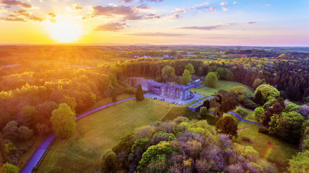 A sunset and lovely landscape of Belleek Castle, one of the best castle hotels in Ireland!