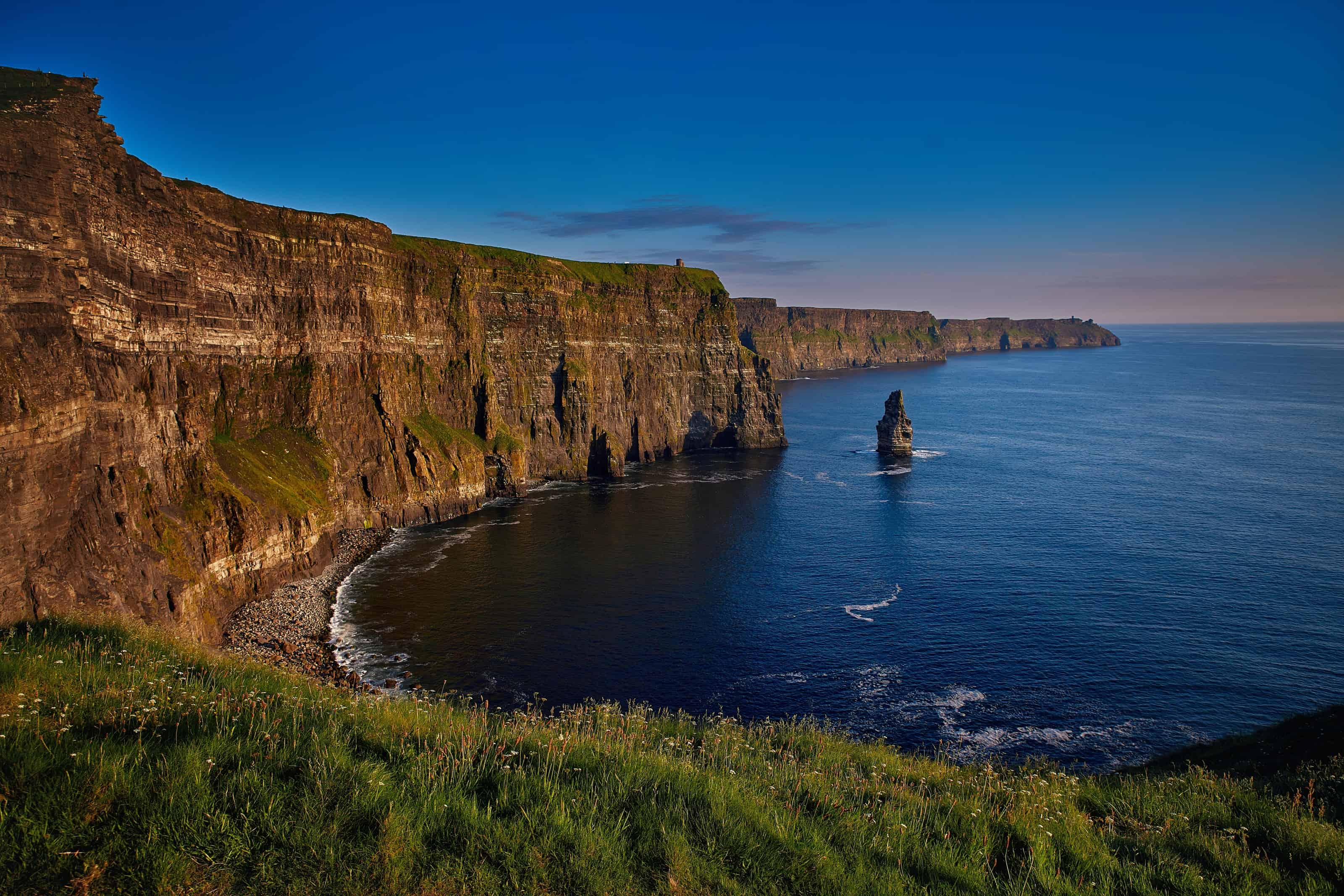 visit the cliffs of moher at sunset on your ireland road trip