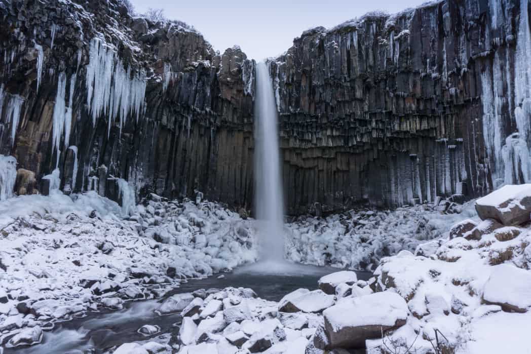 epic things to do in iceland during the winter include hiking to waterfalls