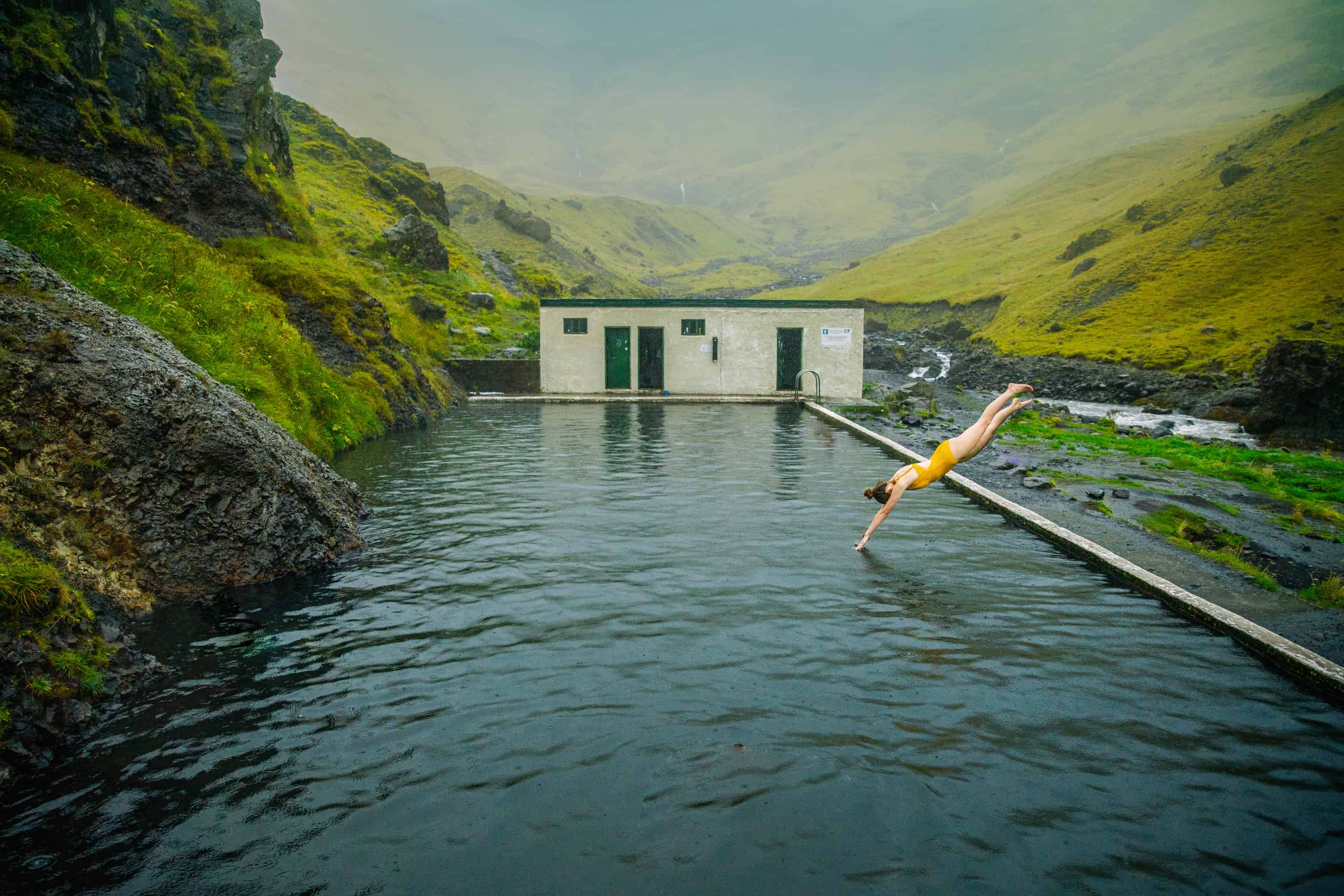 Diving into Seljavallalaug swimming pool in Iceland | Iceland hot springs | where to swim in Iceland for free