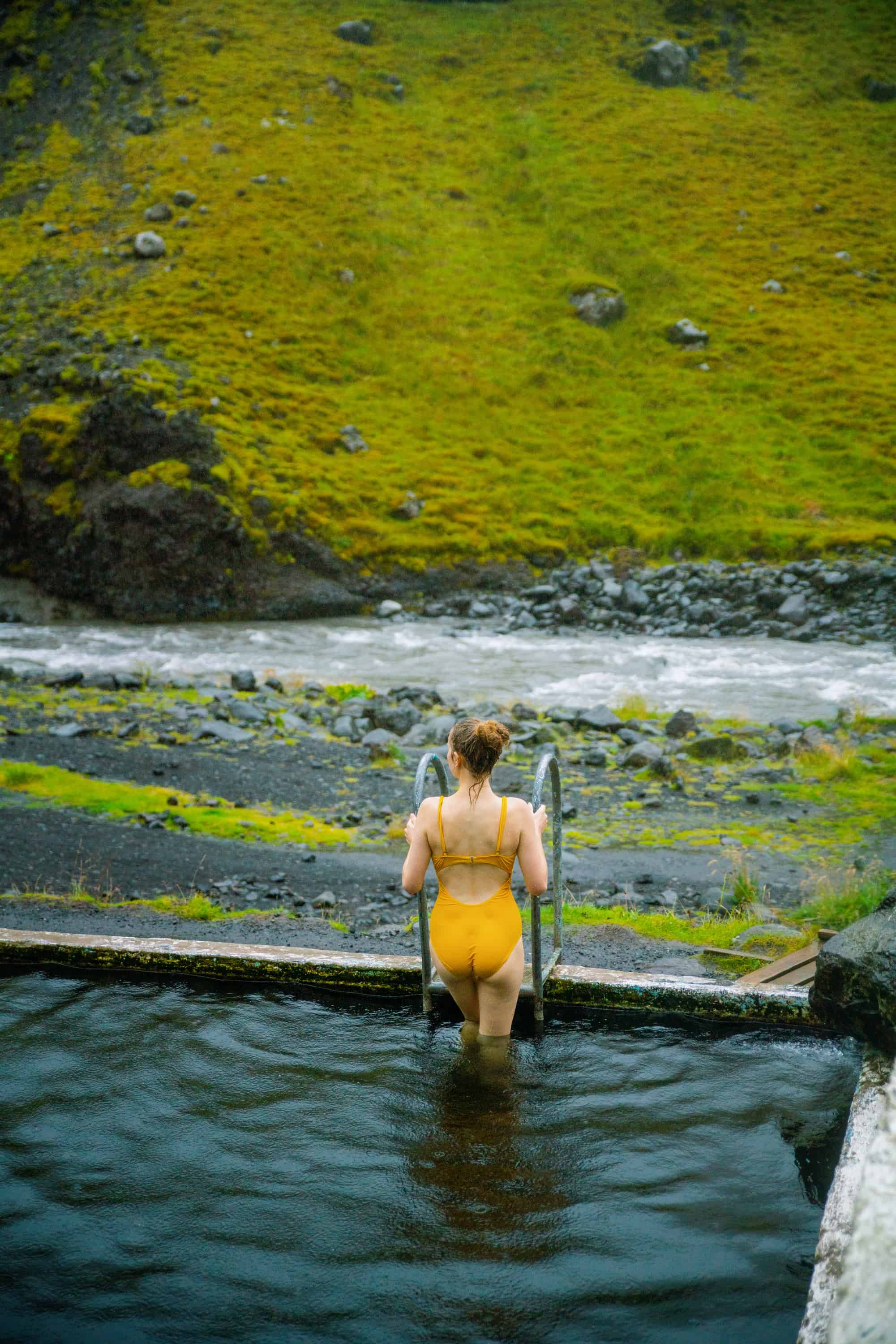 Swimming in Seljavallalaug hot springs in Iceland | Iceland hot spring Seljavallalaug swimming pool