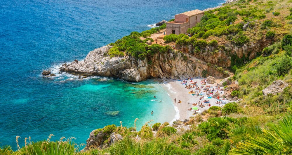 Beautiful Sicily Beach Riserva Naturale Dello Zingaro with people on it