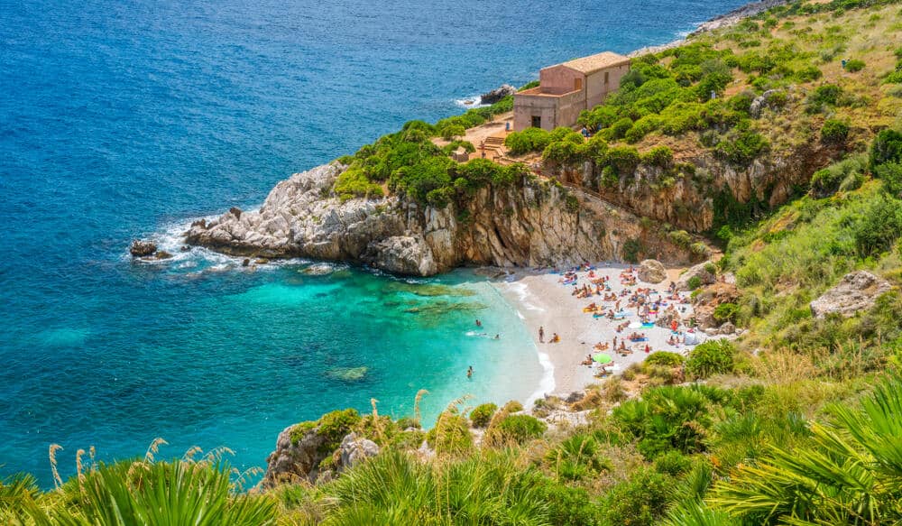 Beautiful Sicily Beach Riserva Naturale Dello Zingaro with people on it