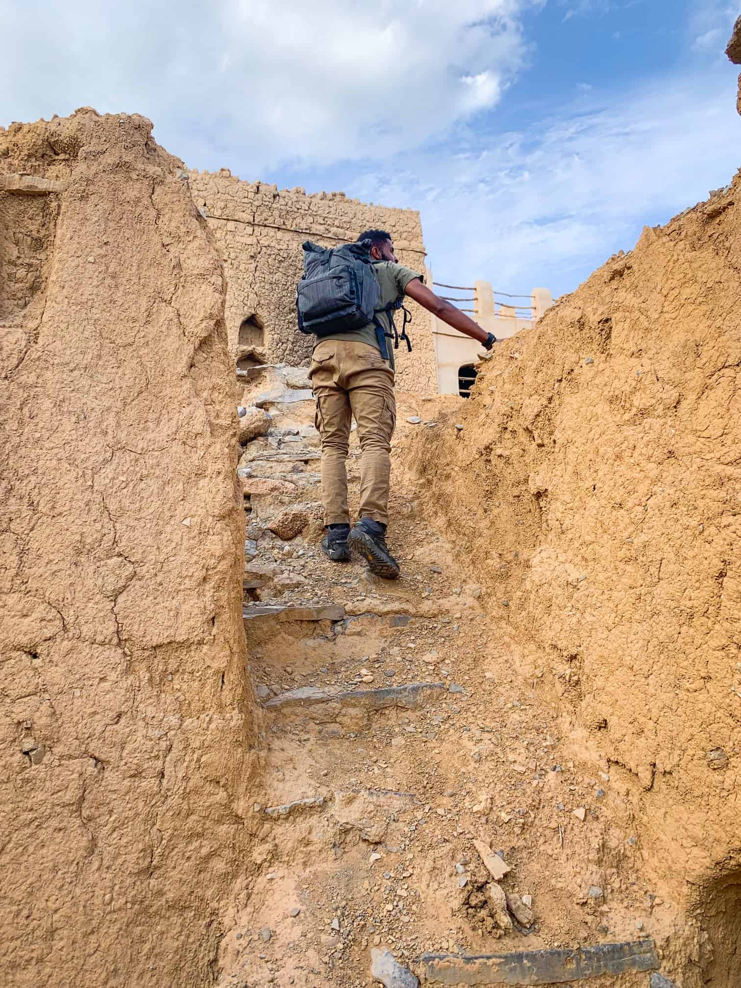 Climbing up stairs in Al Hamra Oman 