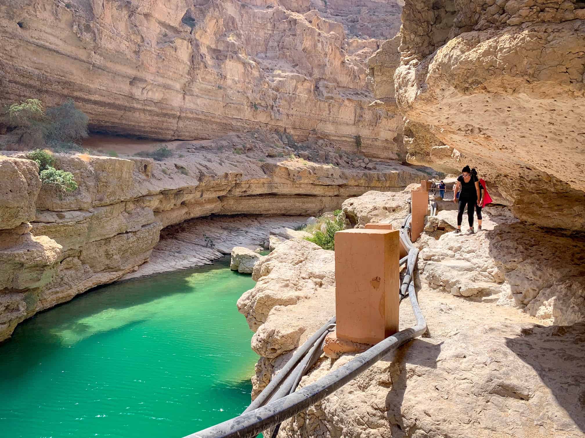 Cliff side hiking in Wadi Shab