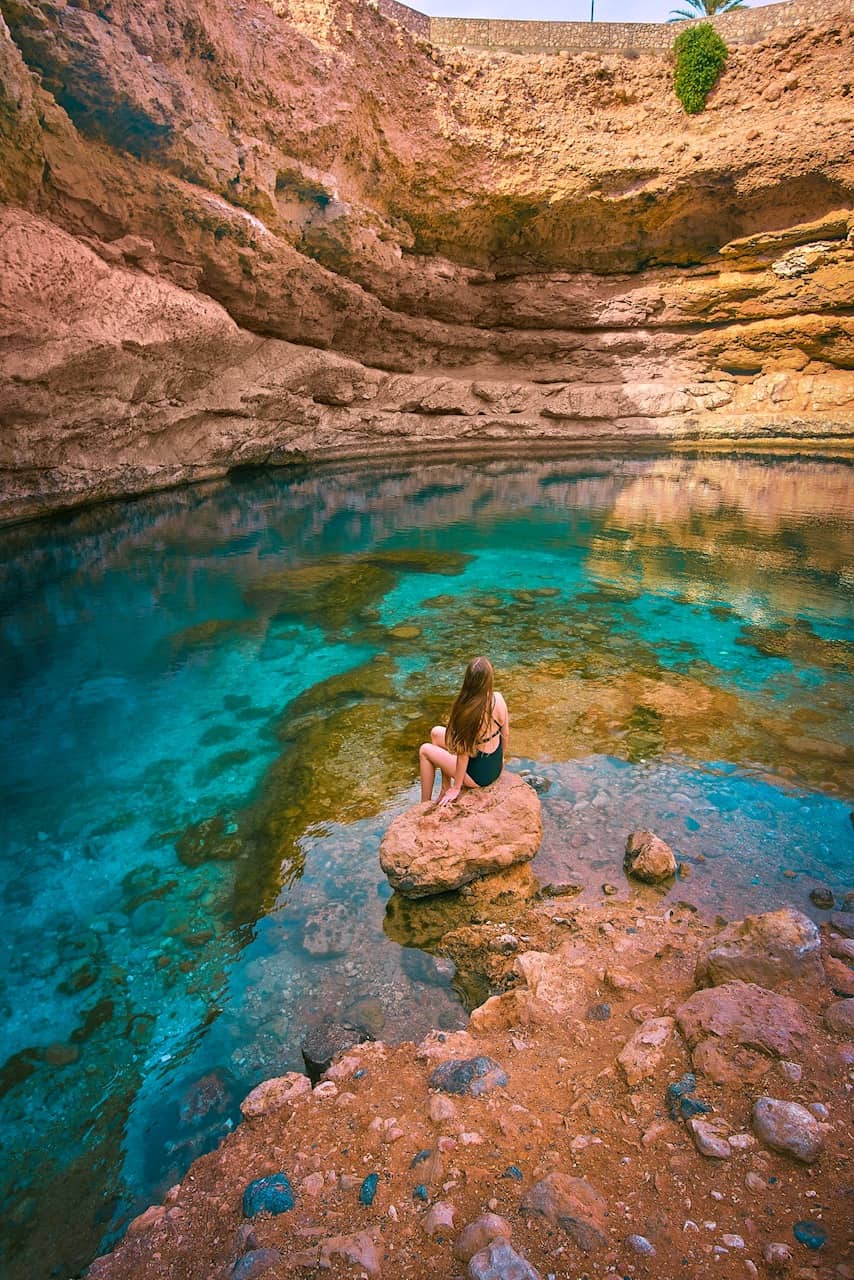 Swimming at Bimmah Sinkhole in Oman