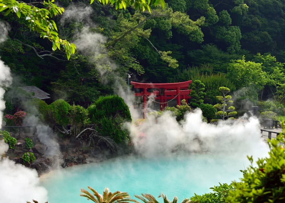 hot spring in Japan with red gate and steam