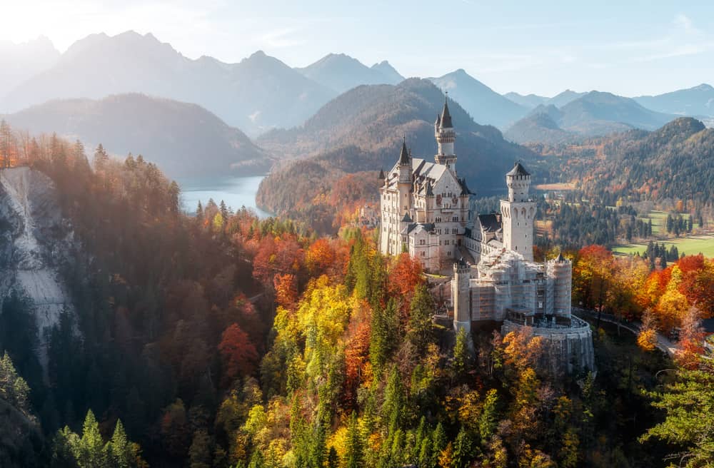 Arguably one of the most beautiful castles in Germany, the view of Neuschwanstein Castle surrounded by trees and mountains is stunning