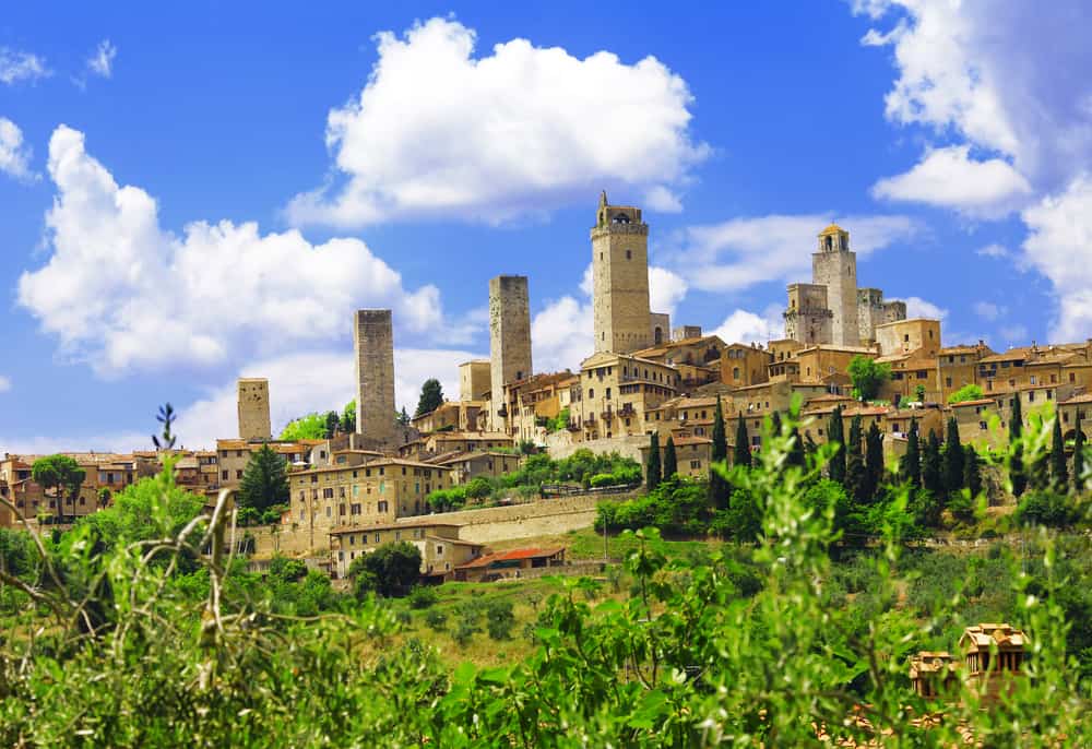 San Gimignano sits in the hills of Tuscany, a beautiful sight with its towers jutting into the blue sky. 