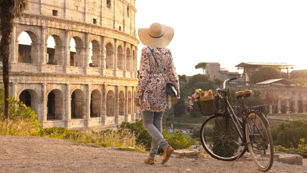photo of woman wearing anti-theft purse she added to her Italy packing list