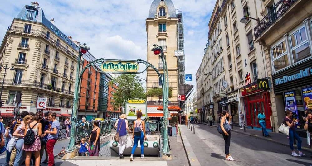 there are many stairs leading to Paris metro stations