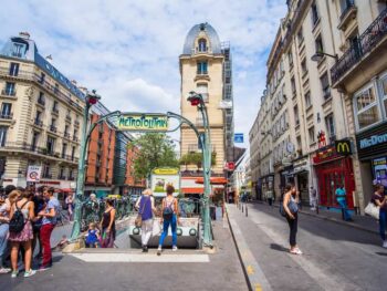 there are many stairs leading to Paris metro stations