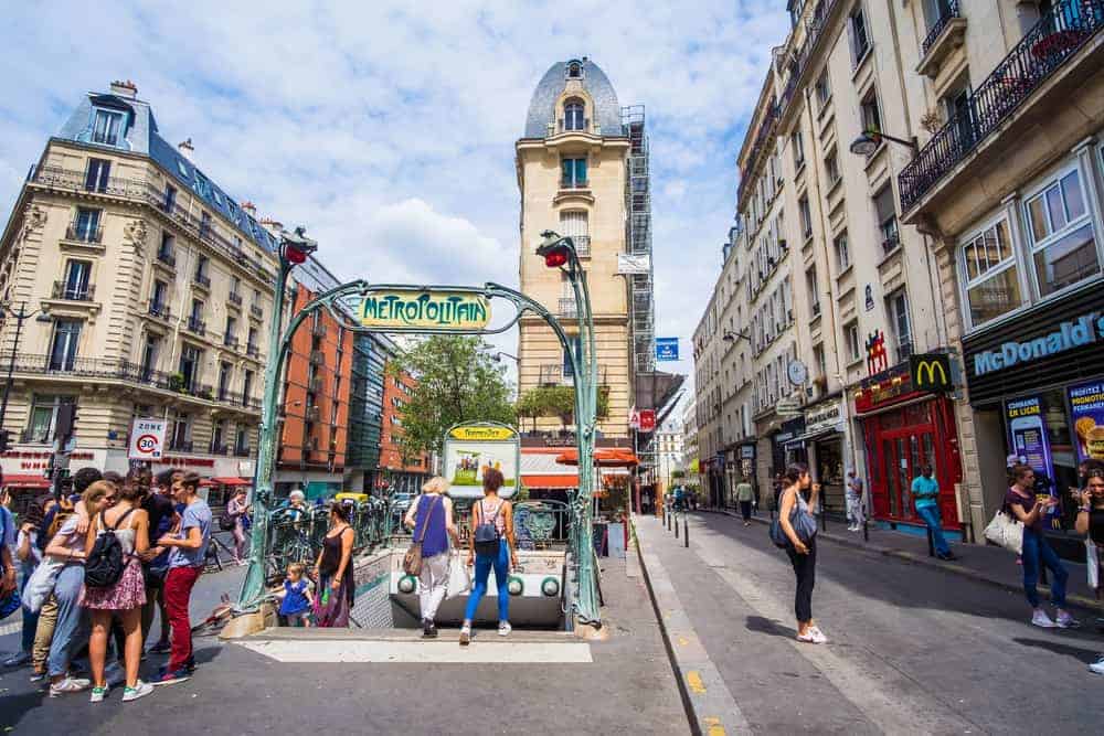 there are many stairs leading to Paris metro stations