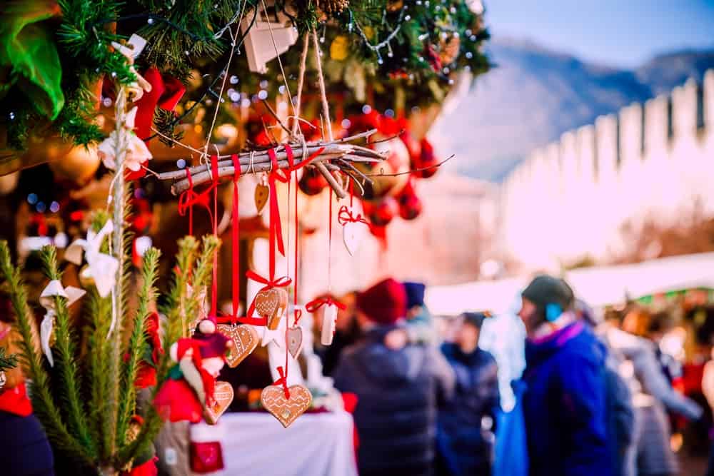 Traditional Kiosks and Shoppers in the Vipiteno Christmas Market