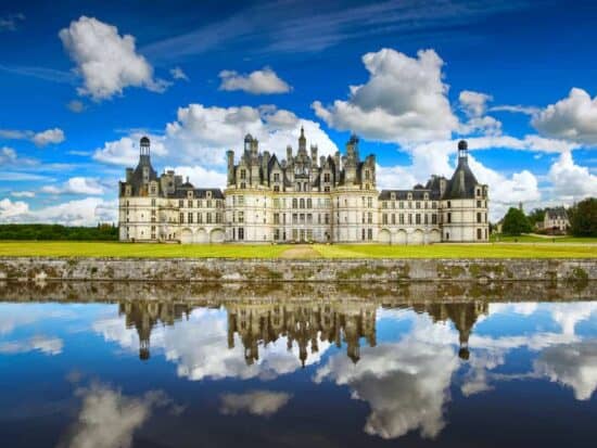 stunning view and lake reflection of Chateau de Chambord castle in France