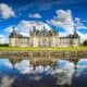 stunning view and lake reflection of Chateau de Chambord castle in France