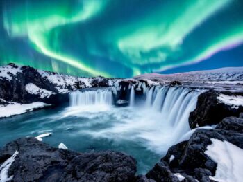 Northern Lights over Goðafoss in Iceland in December