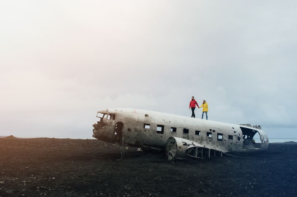 people walking on top of the Iceland plane crash
