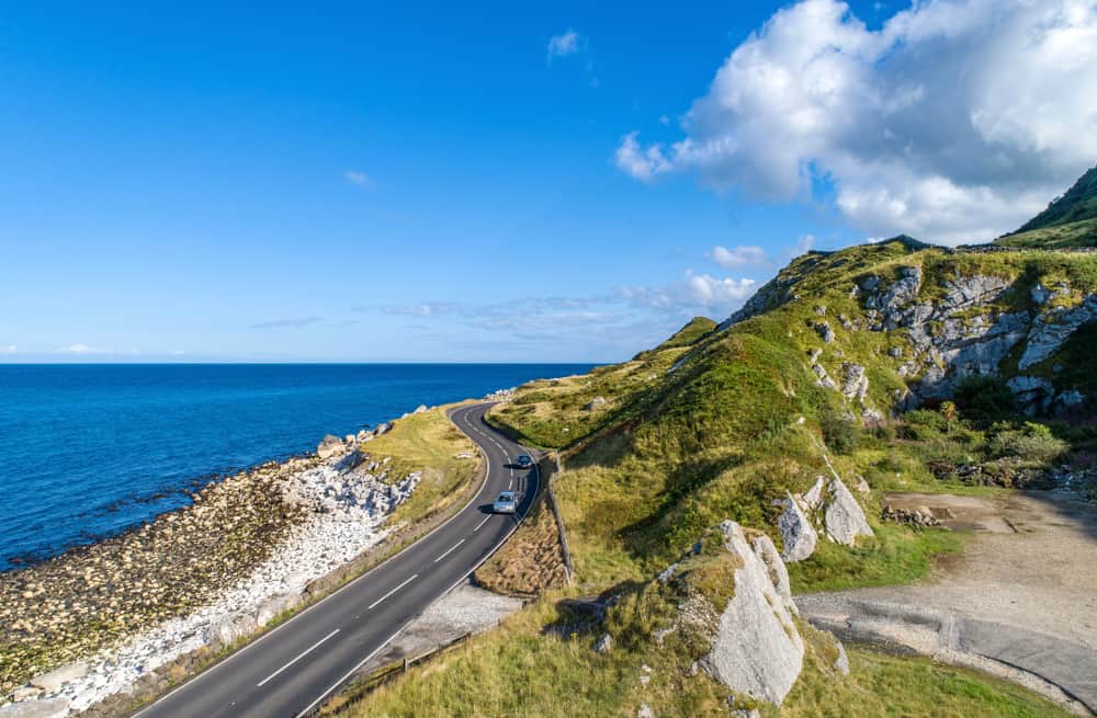 road in ireland with car showing renting a car in ireland