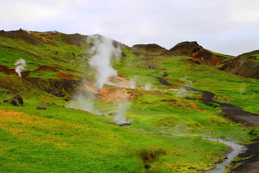 steam filling the valley on the way to Reykjadalur Hot Springs