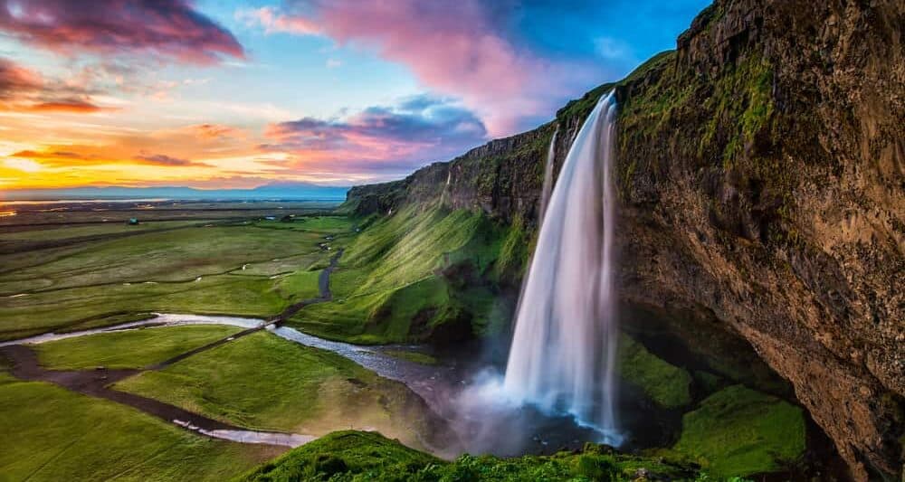 summer at Seljalandsfoss waterfall in South Iceland