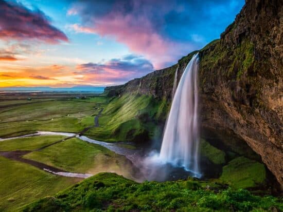 summer at Seljalandsfoss waterfall in South Iceland