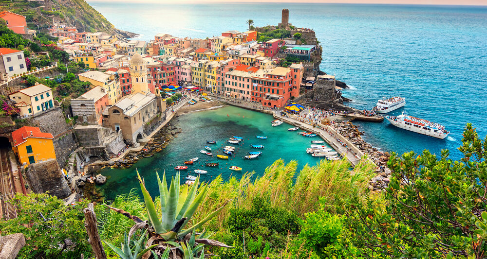 Pretty sunset over a cinque terre village you will see on your Italy itinerary