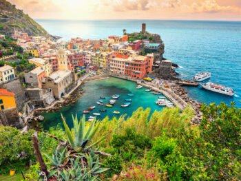 Pretty sunset over a cinque terre village you will see on your Italy itinerary