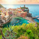 Pretty sunset over a cinque terre village you will see on your Italy itinerary