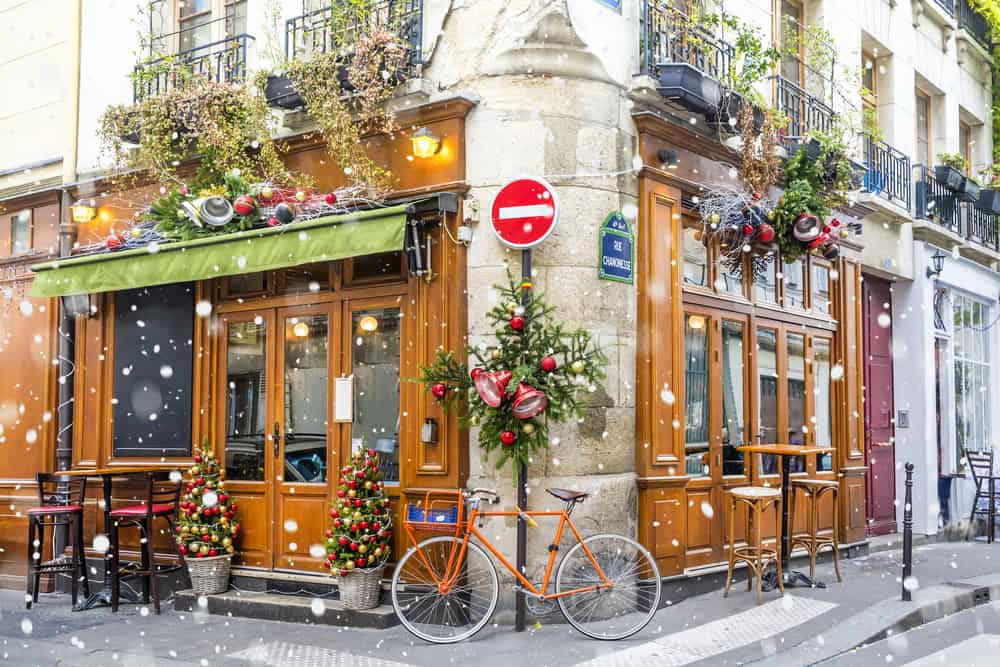 Visit a decorated cafe during christmas in paris