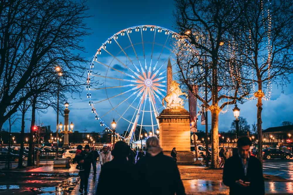 ride the ferris wheel during christmas in paris