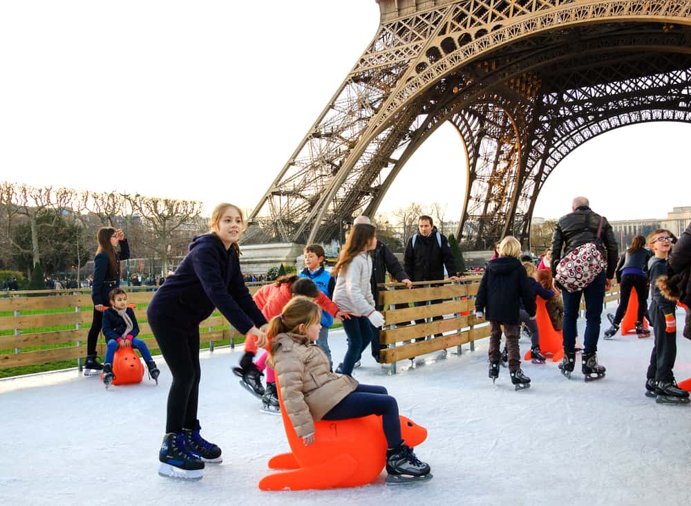 ice skating at the eiffel tower is a great way to spend christmas in paris