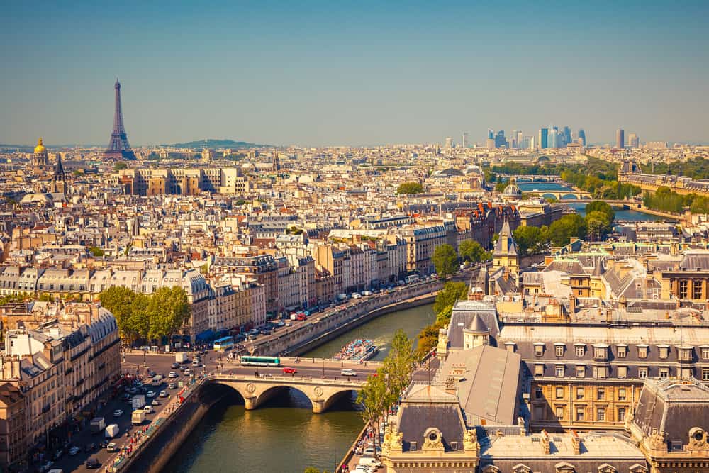 Skyline of paris from the Notre Dame Cathedral including the Seine River, the Eiffel tower and skyscrapers