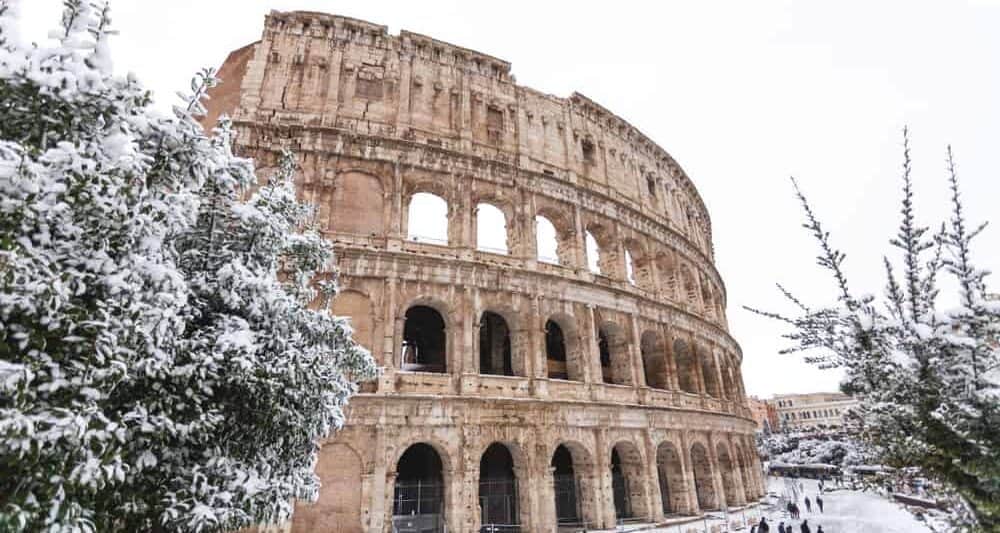 The Coliseum covered in snow during winter in Rome