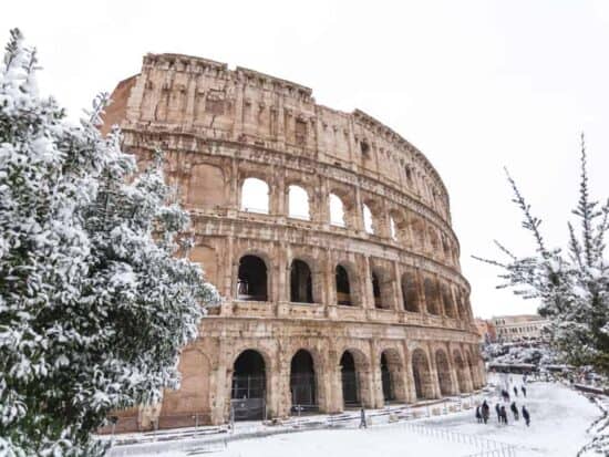 The Coliseum covered in snow during winter in Rome