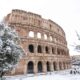 The Coliseum covered in snow during winter in Rome