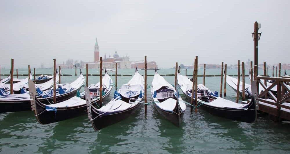 Enjoy a Gondola Ride with a blanket while visiting Venice in winter