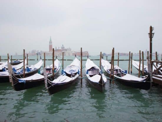 Enjoy a Gondola Ride with a blanket while visiting Venice in winter