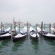 Enjoy a Gondola Ride with a blanket while visiting Venice in winter
