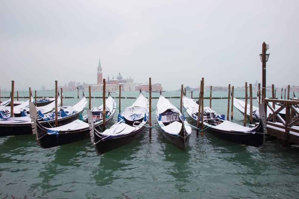 Enjoy a Gondola Ride with a blanket while visiting Venice in winter