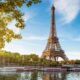 View of the Eiffel Tower with the Seine and riverboats