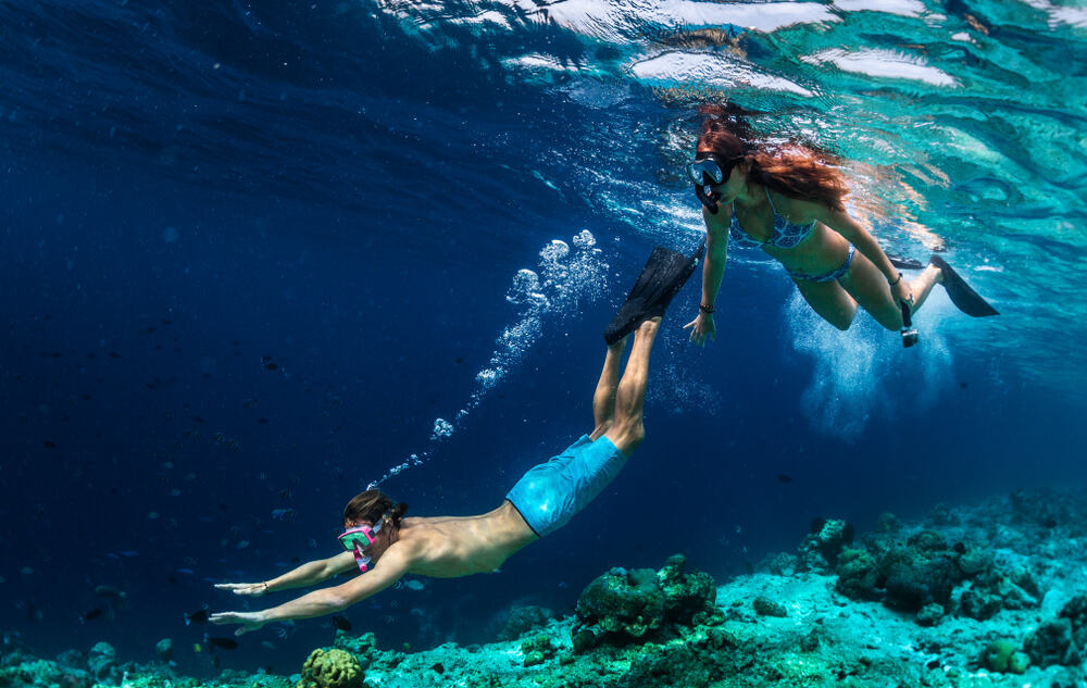 Photo of Couple Swimming in the Maldives