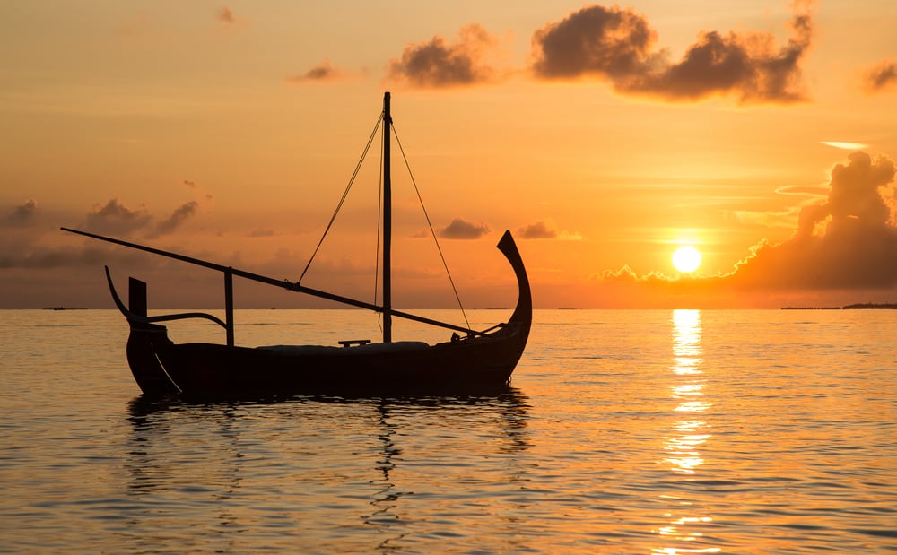 Photo of Sailboat at Sunset in the Maldives