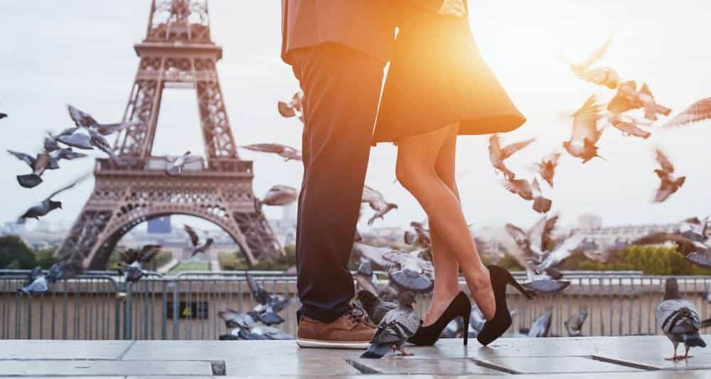 couple at sunrise on their paris honeymoon